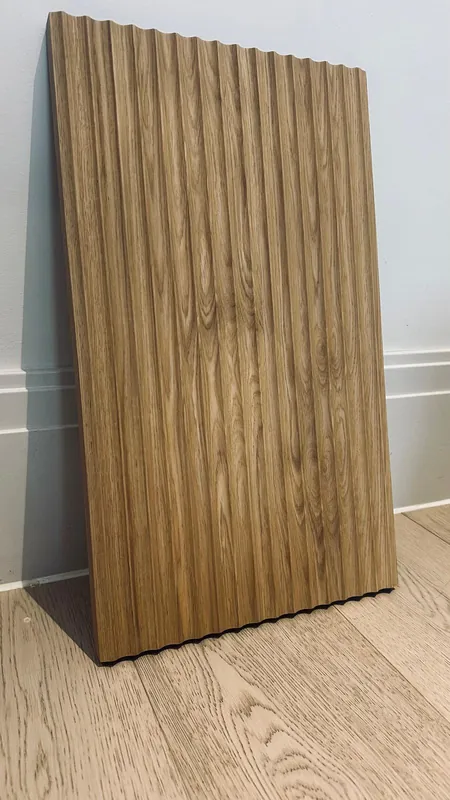 Real oak fluted panel sample leaning against a wall