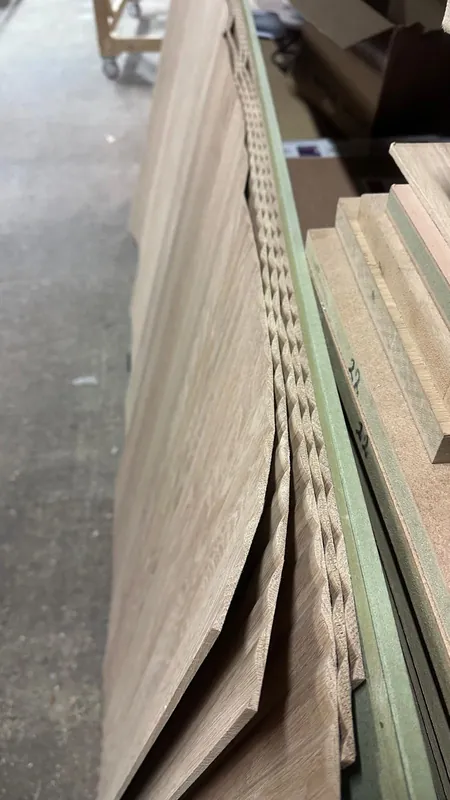 Flexible fluted veneer sheets flexing in the workshop