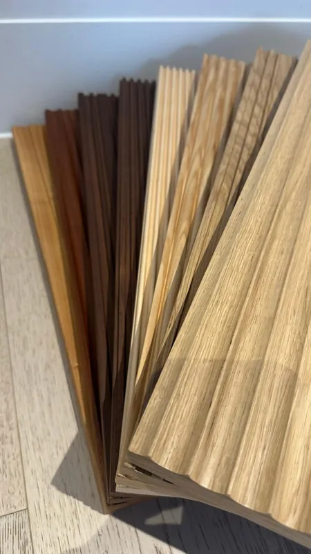 Fan of fluted timber samples from pale oak to dark walnut