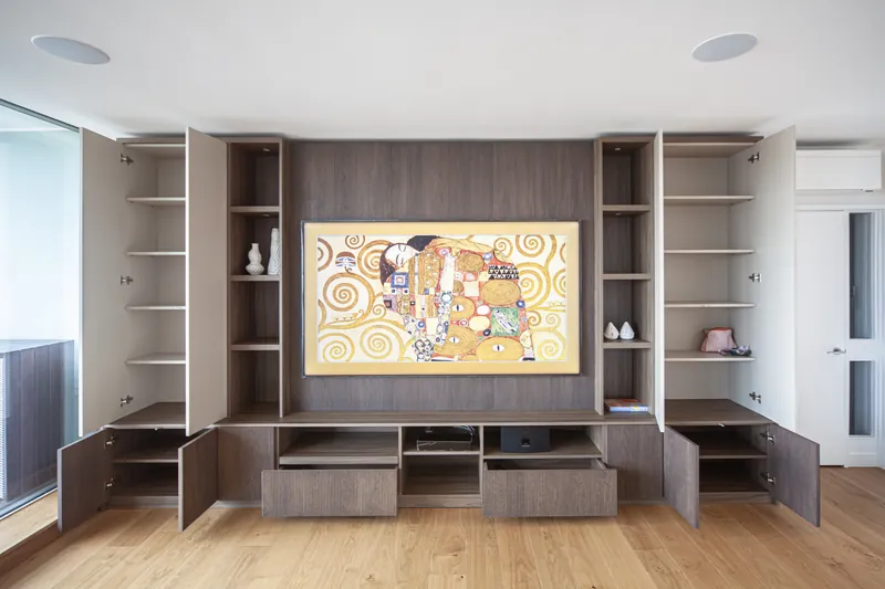 Fluted media unit with doors open showing internal storage