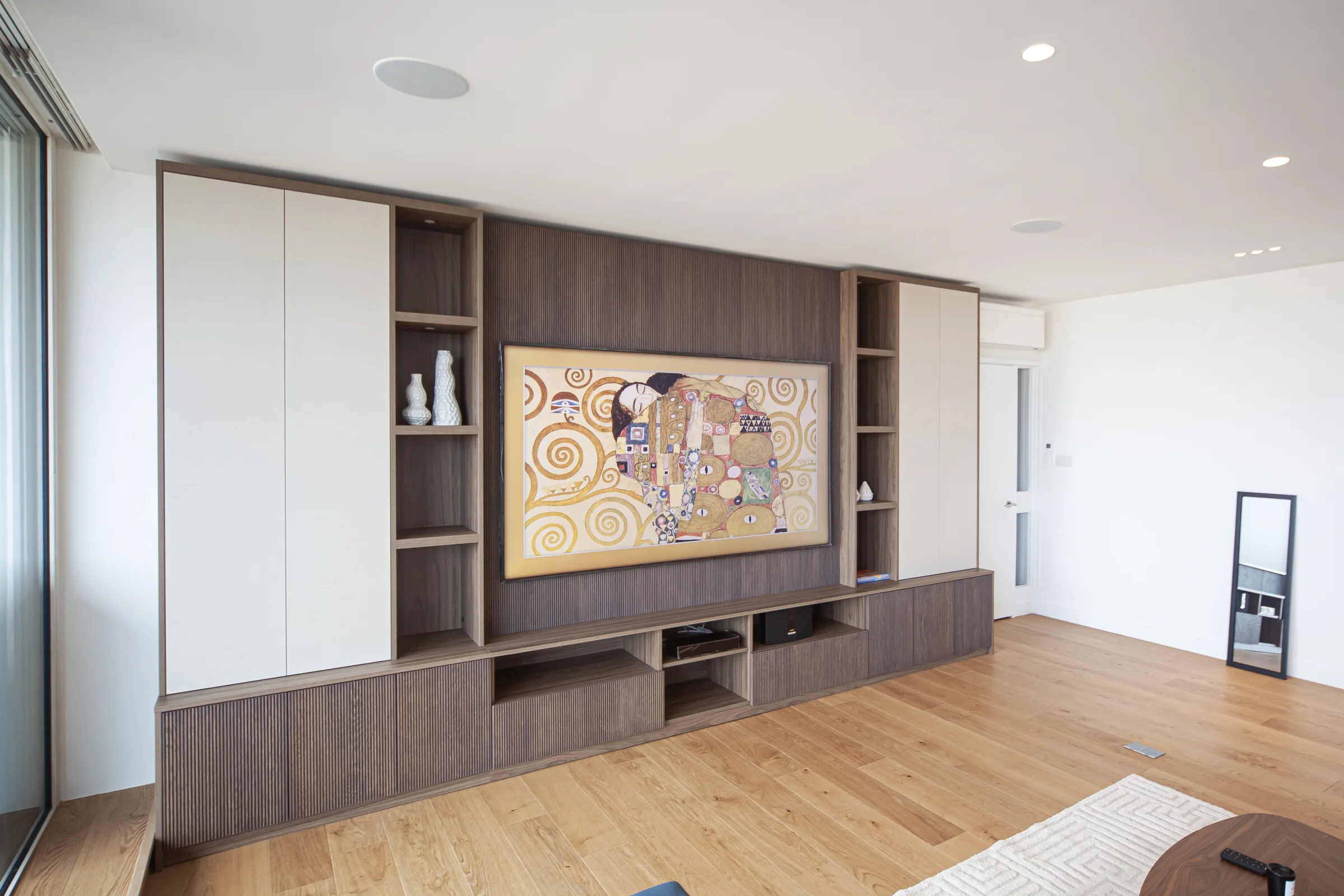 Bespoke American walnut media joinery with fluted fronts